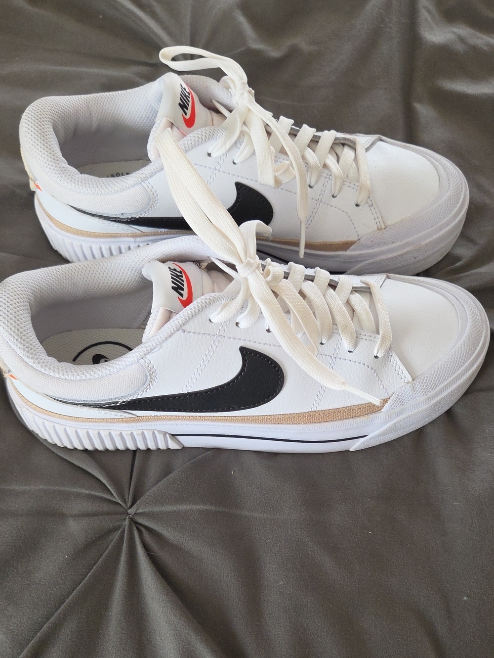 Nike Men’s White Sneakers with Black Swoosh and Gold Trim